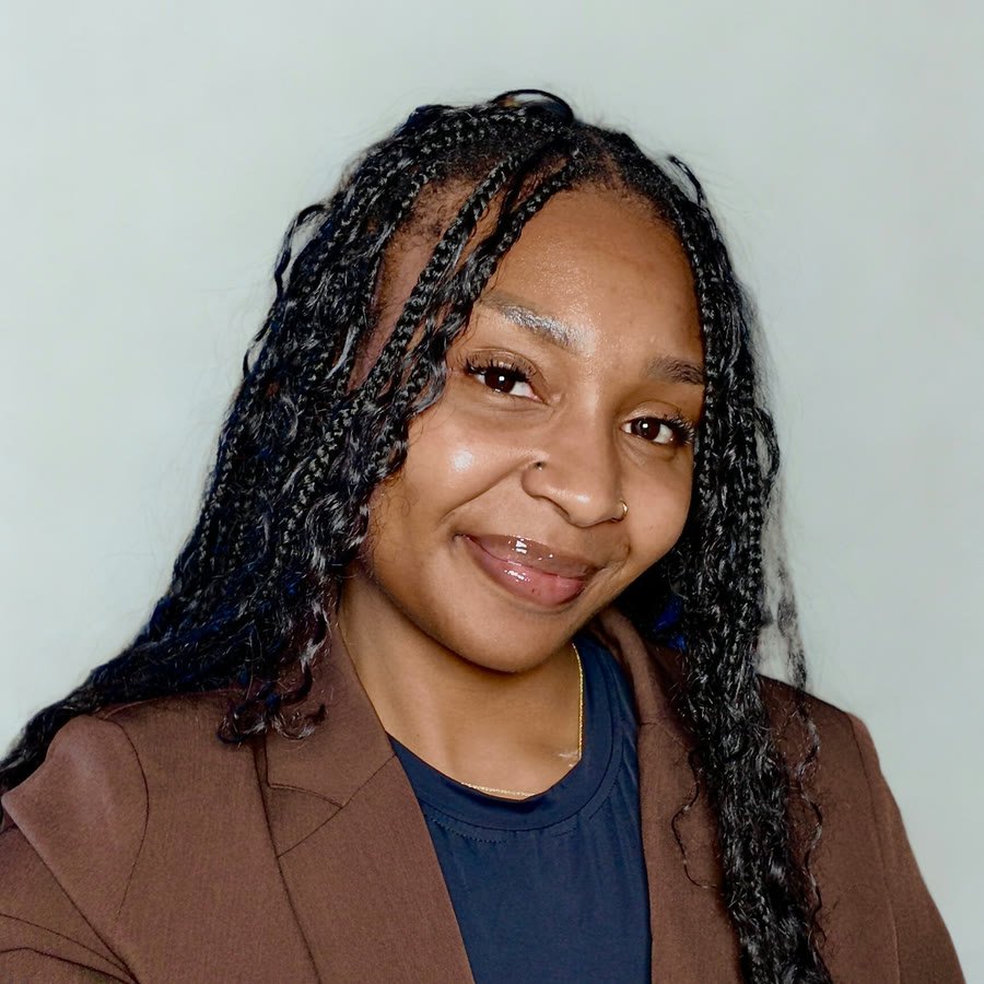 Portrait of Shana Francis in a brown blazer